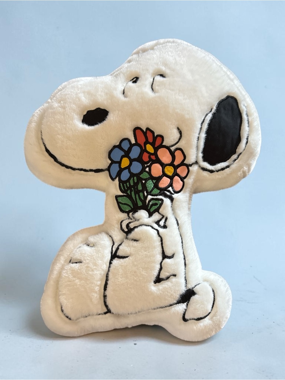 Spring Snoopy-shaped decorative pillow.